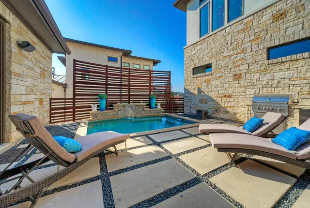a view of backyard with a patio