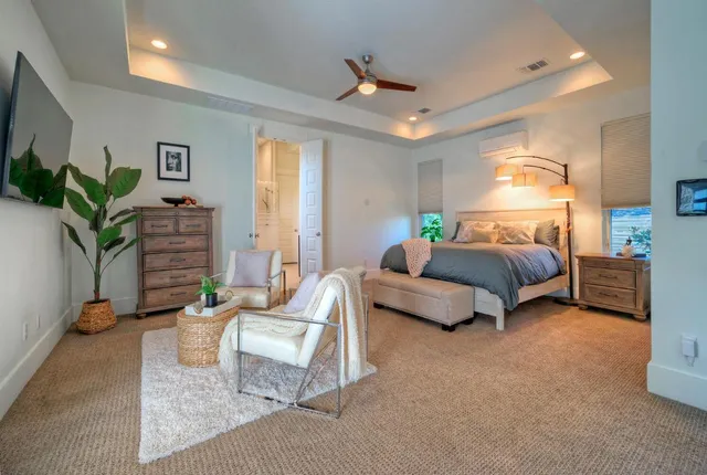 a bedroom with a bed and a couch