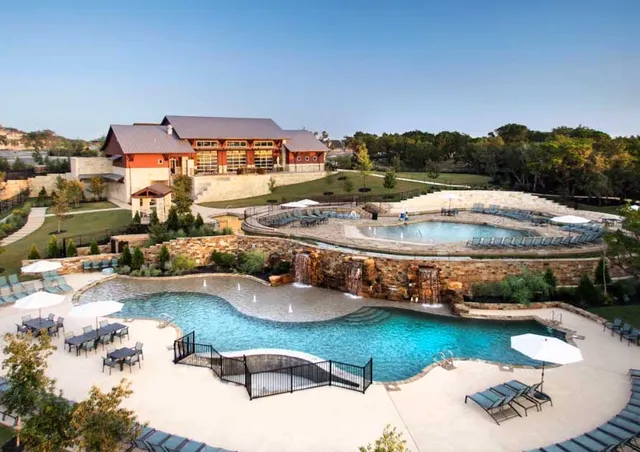 a view of swimming pool outdoor seating and lake view