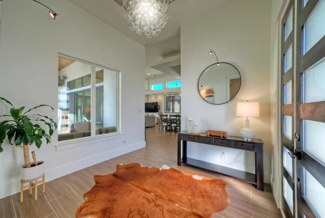 a view of a livingroom with furniture and a chandelier