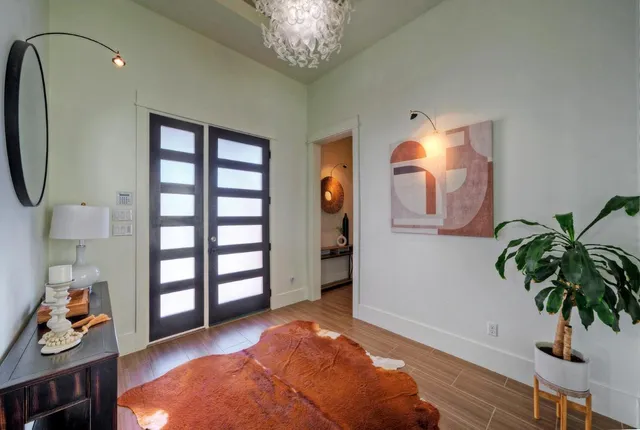a view of a livingroom with furniture and closet