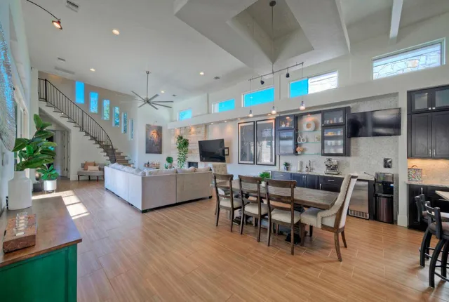 a dining room with furniture and wooden floor
