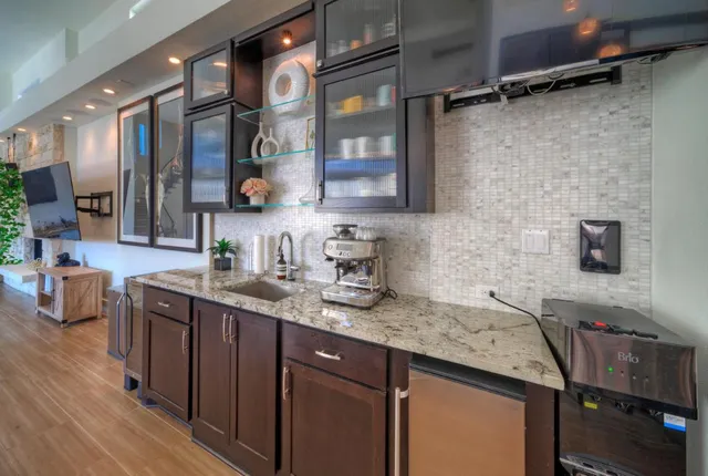a kitchen with a sink stove and cabinets