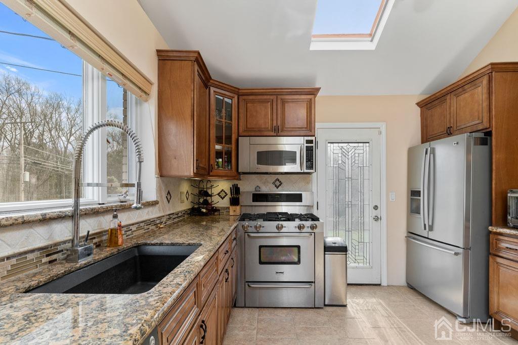436 Tennent Road Morganville, NJ 07751 - Photo 13 of 36 Kitchen has side door entrance