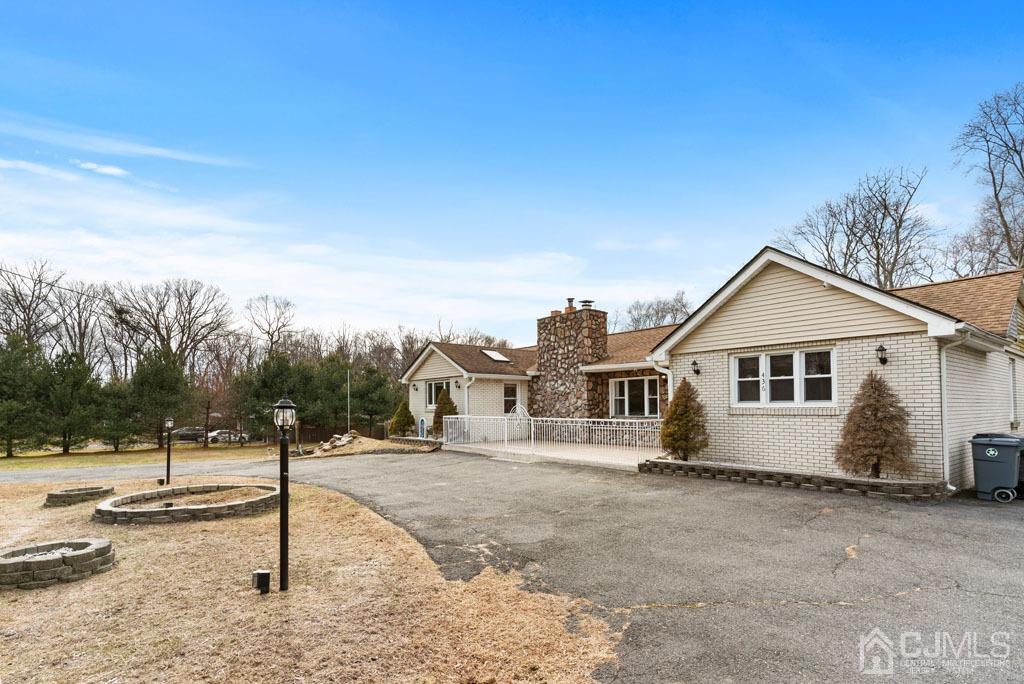 436 Tennent Road Morganville, NJ 07751 - Photo 3 of 36 Other angle of house with large driveway