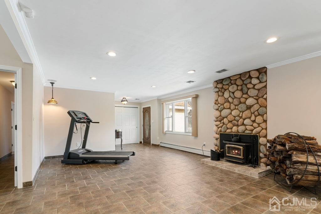 436 Tennent Road Morganville, NJ 07751 - Photo 5 of 36 Foyer/living room area with wood burning fireplace