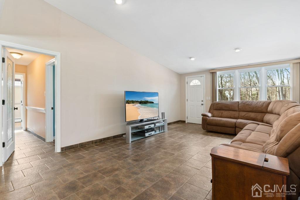 436 Tennent Road Morganville, NJ 07751 - Photo 8 of 36 Family Room with access to paver patio in backyard
