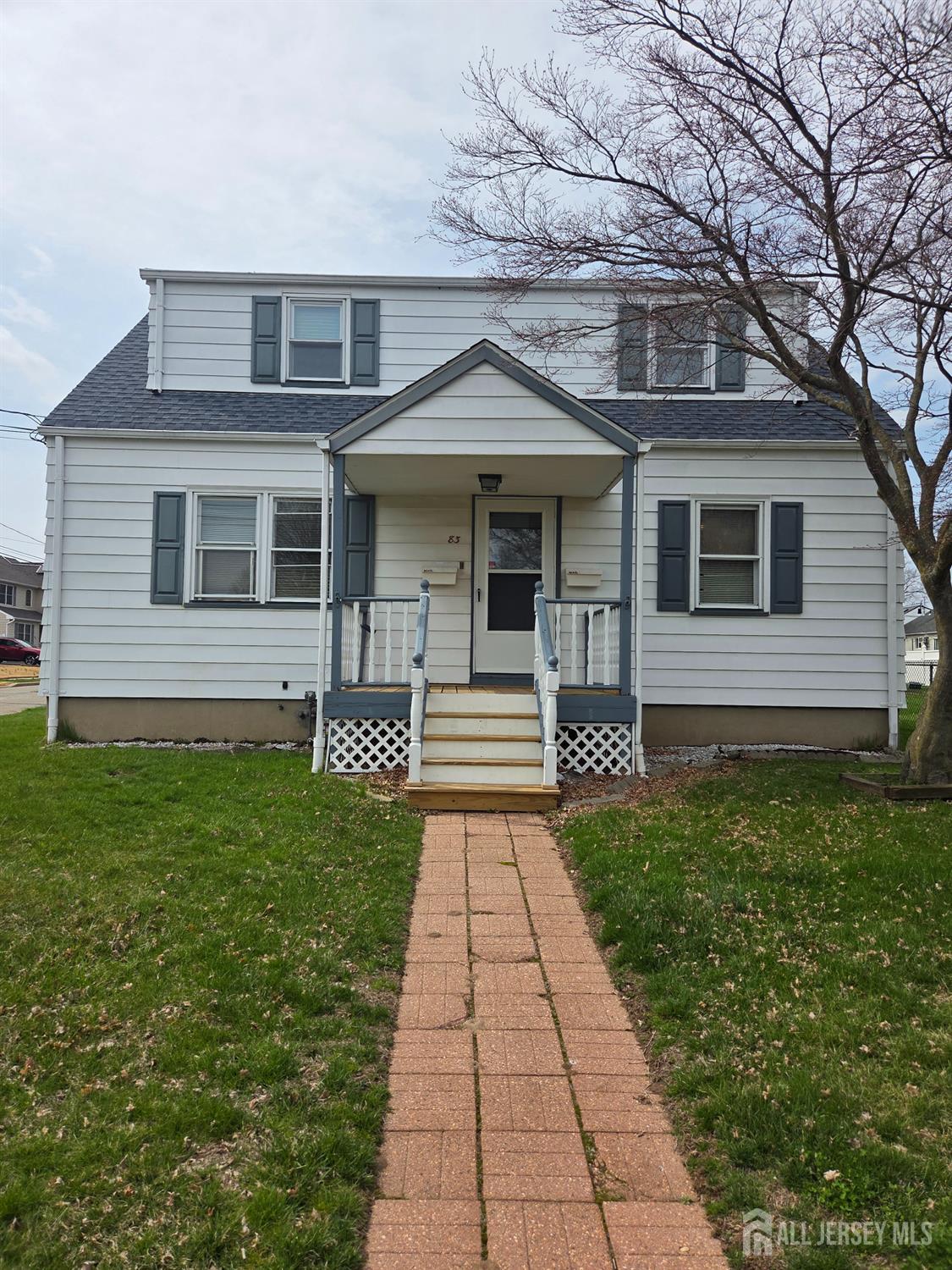 83 Daniel Street Port Reading, NJ 07064 - Photo 1 of 15 a front view of a house with garden