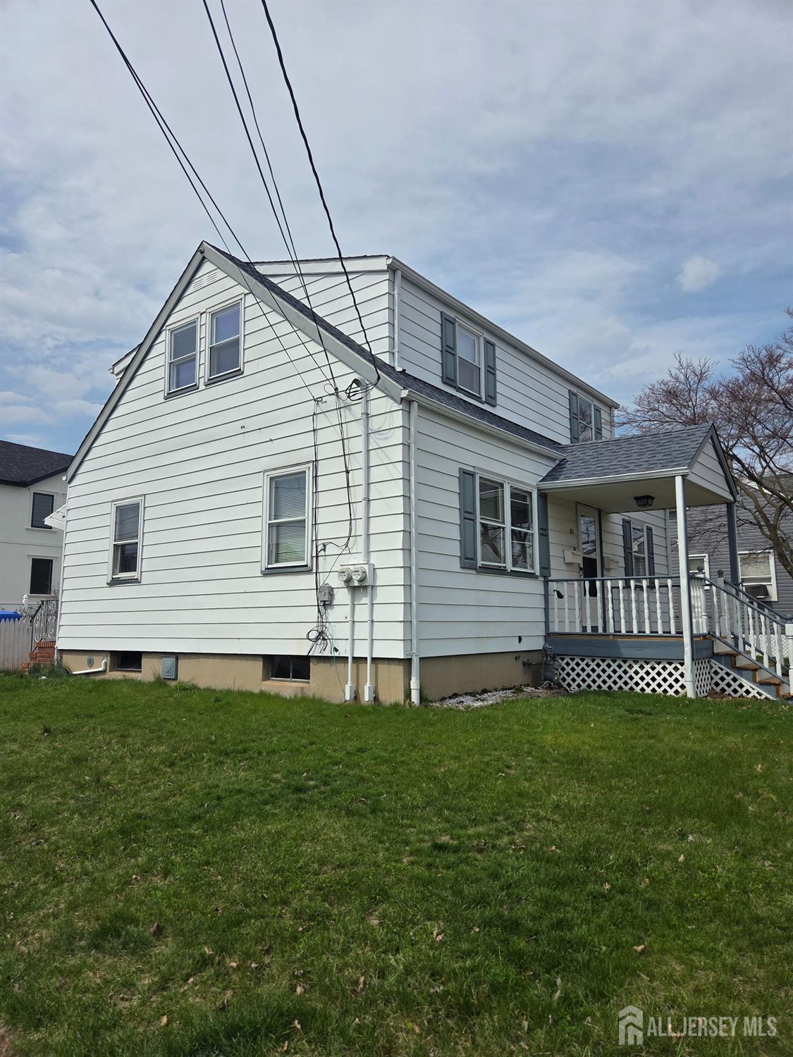 83 Daniel Street Port Reading, NJ 07064 - Photo 3 of 15 a front view of house with yard
