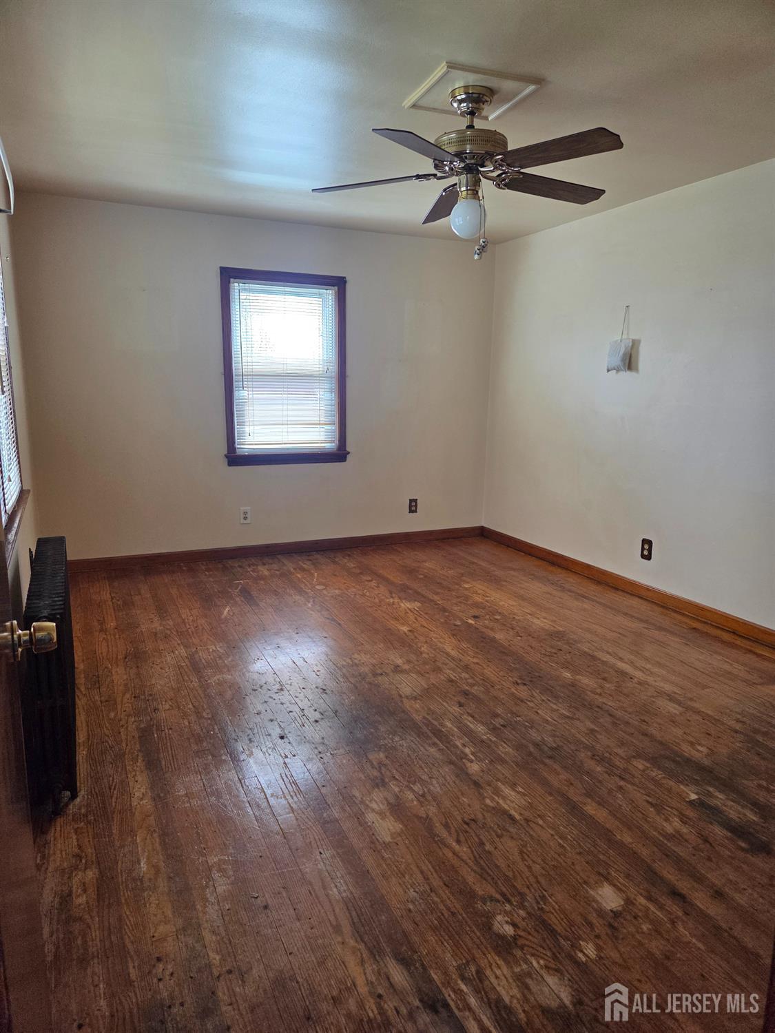 83 Daniel Street Port Reading, NJ 07064 - Photo 5 of 15 a view of an empty room with a window