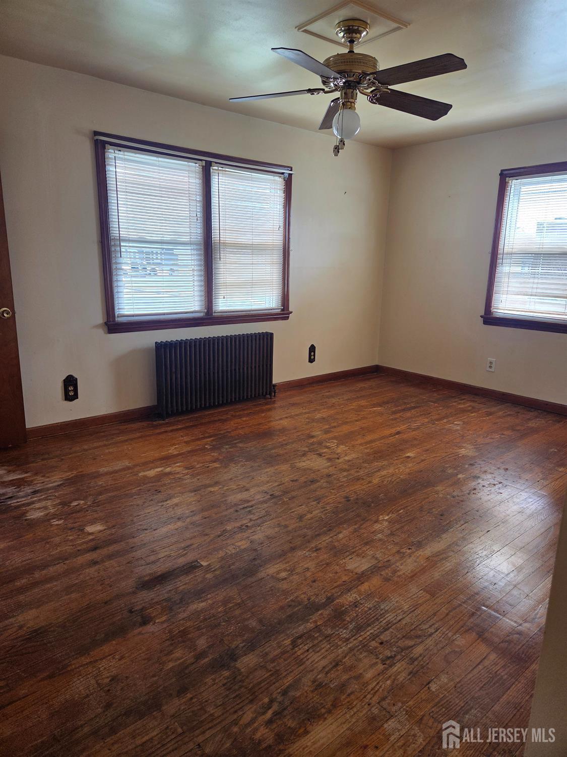 83 Daniel Street Port Reading, NJ 07064 - Photo 6 of 15 an empty room with windows