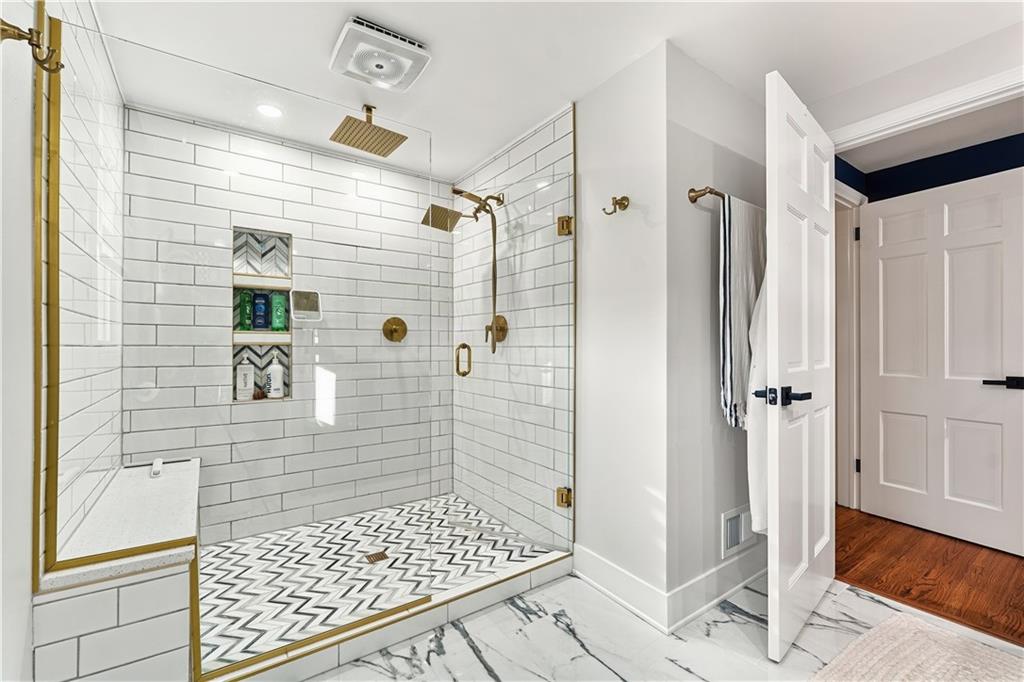 736 Pinetree Road Pittsburgh, PA 15243 - Photo 25 of 43 This luxurious primary bath will bring a touch of luxury to your daily routine. Enjoy the convenience of dual sinks, oversized walk in shower with rainfall shower heads, a bulit in seat for comfort and a niche for all your for all your toiletries.