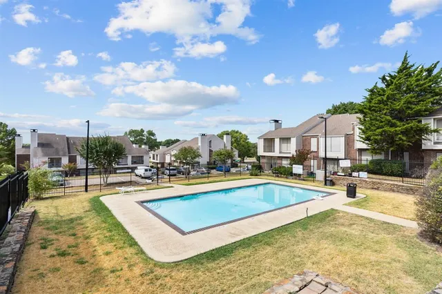 a view of a swimming pool with a lounge chairs