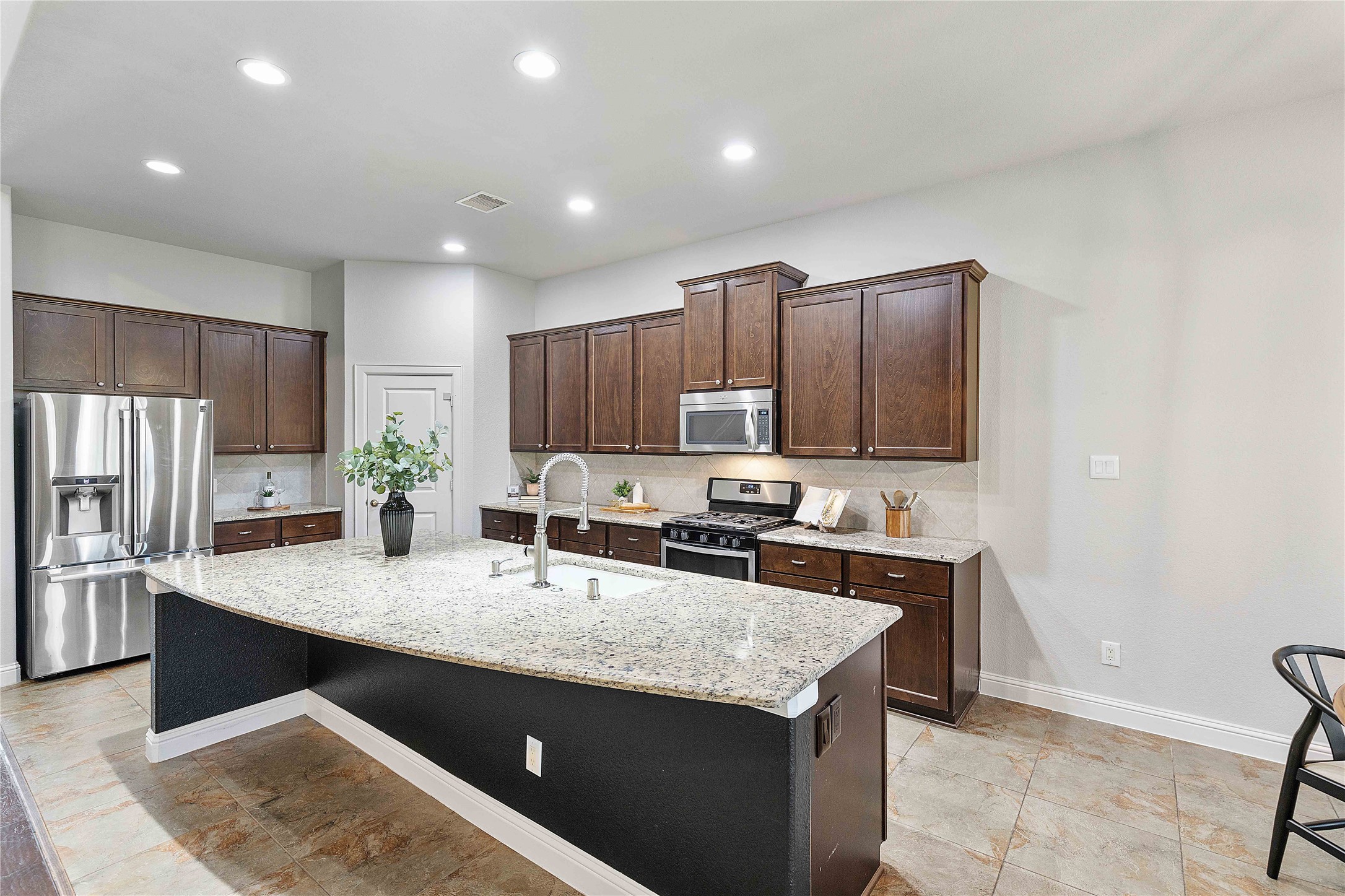 29539 Monona Terrace Court Spring, TX 77386 - Photo 18 of 50 Refrigerator can convey with the home, making this space truly move-in ready! *Staged furniture and accessories do not convey with the home*