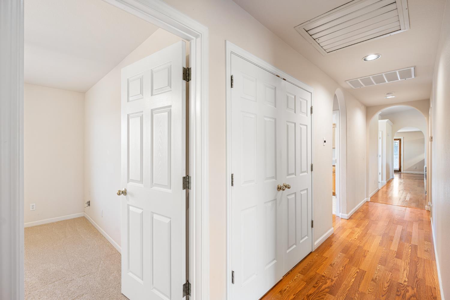 14304 Huntington Road Madera, CA 93636 - Photo 19 of 33 a view of a hallway with a wooden floor