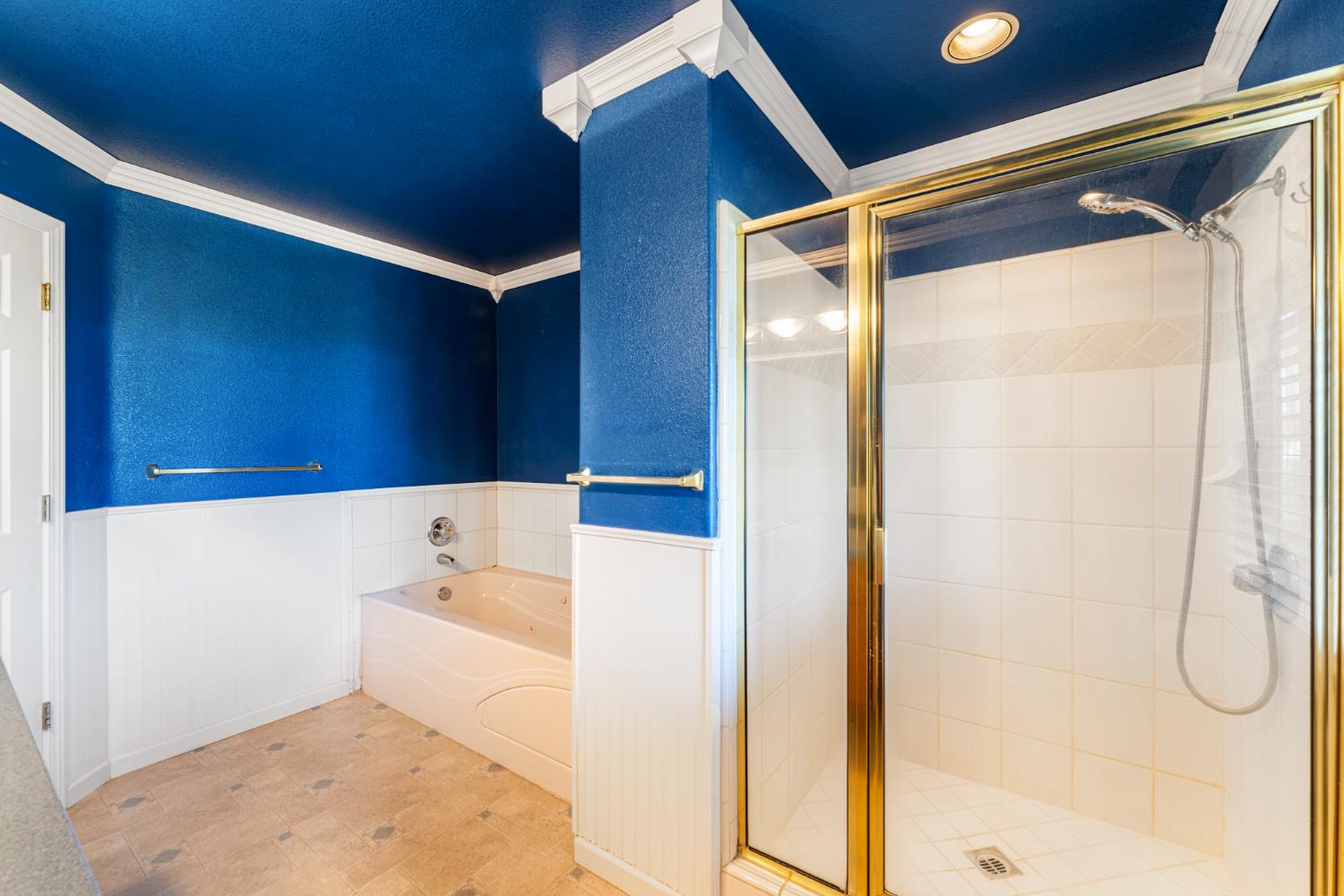 14304 Huntington Road Madera, CA 93636 - Photo 24 of 33 a bathroom with a tub and shower