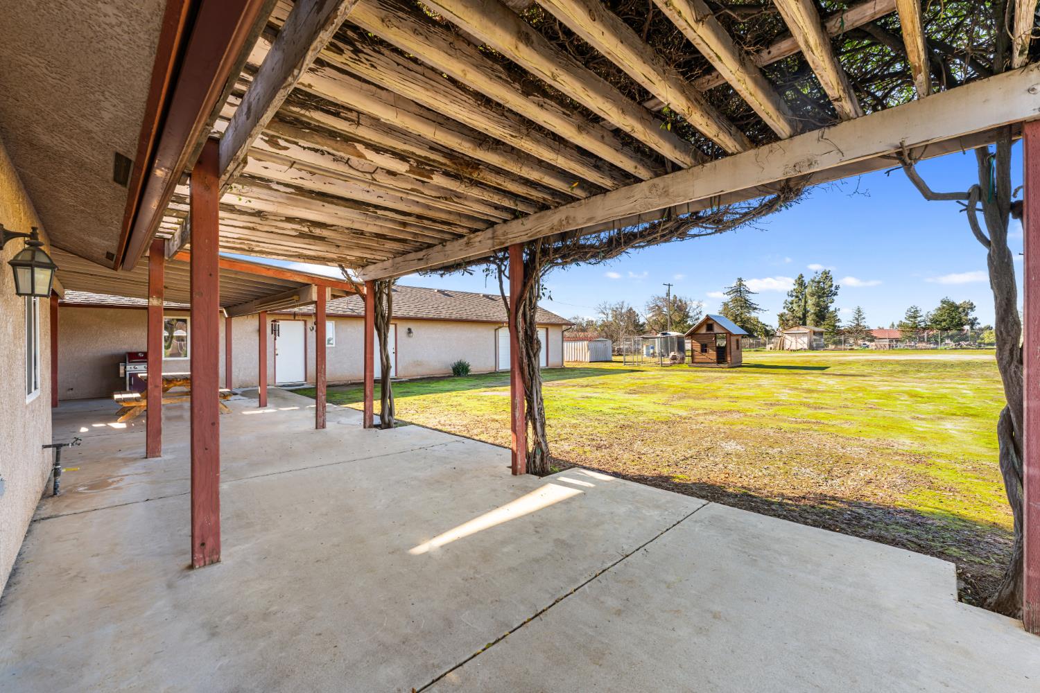 14304 Huntington Road Madera, CA 93636 - Photo 26 of 33 a view of a swimming pool with an outdoor seating