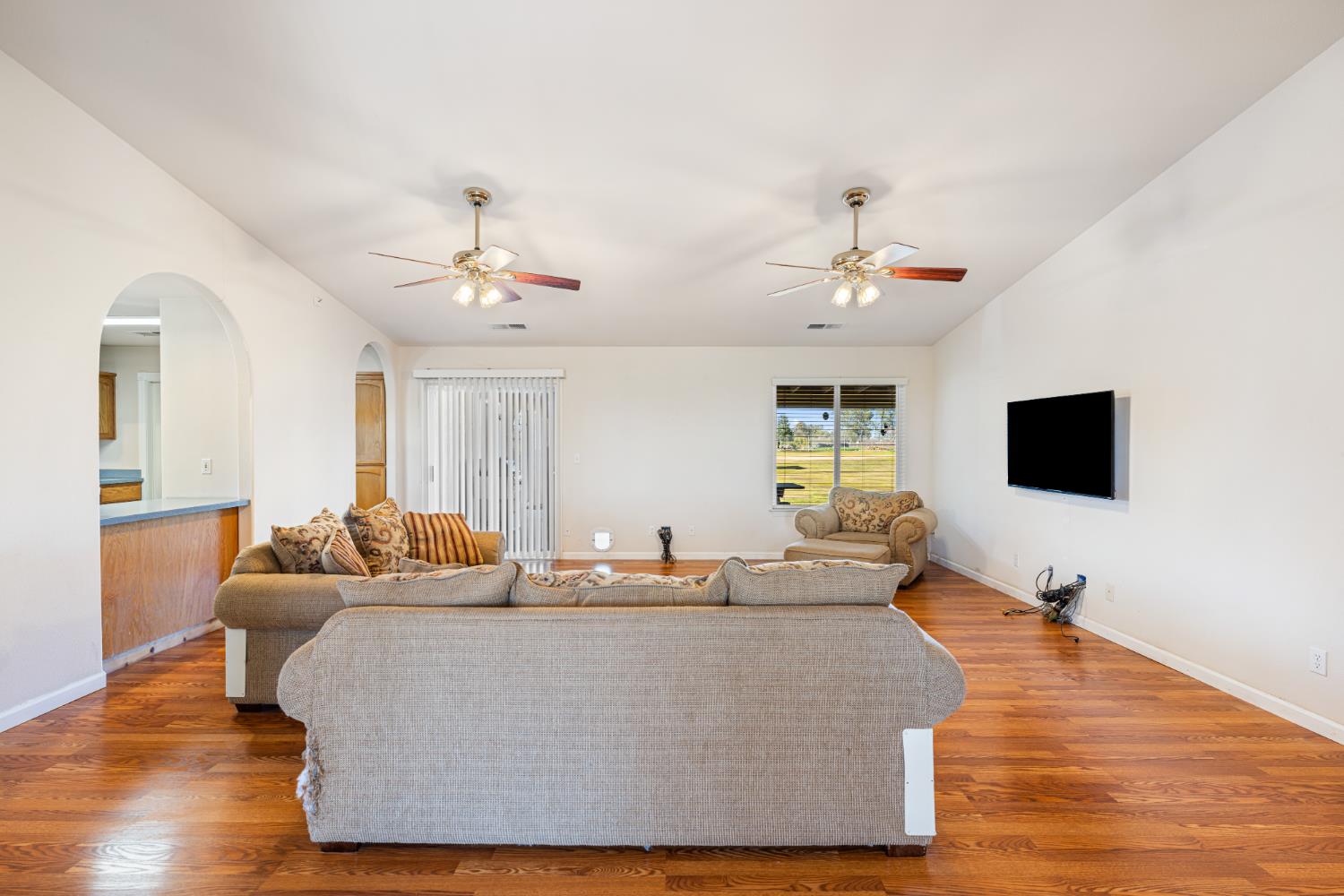 14304 Huntington Road Madera, CA 93636 - Photo 5 of 33 a living room with furniture and a flat screen tv