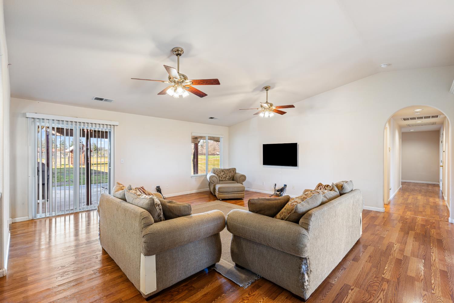 14304 Huntington Road Madera, CA 93636 - Photo 6 of 33 a living room with furniture and a flat screen tv