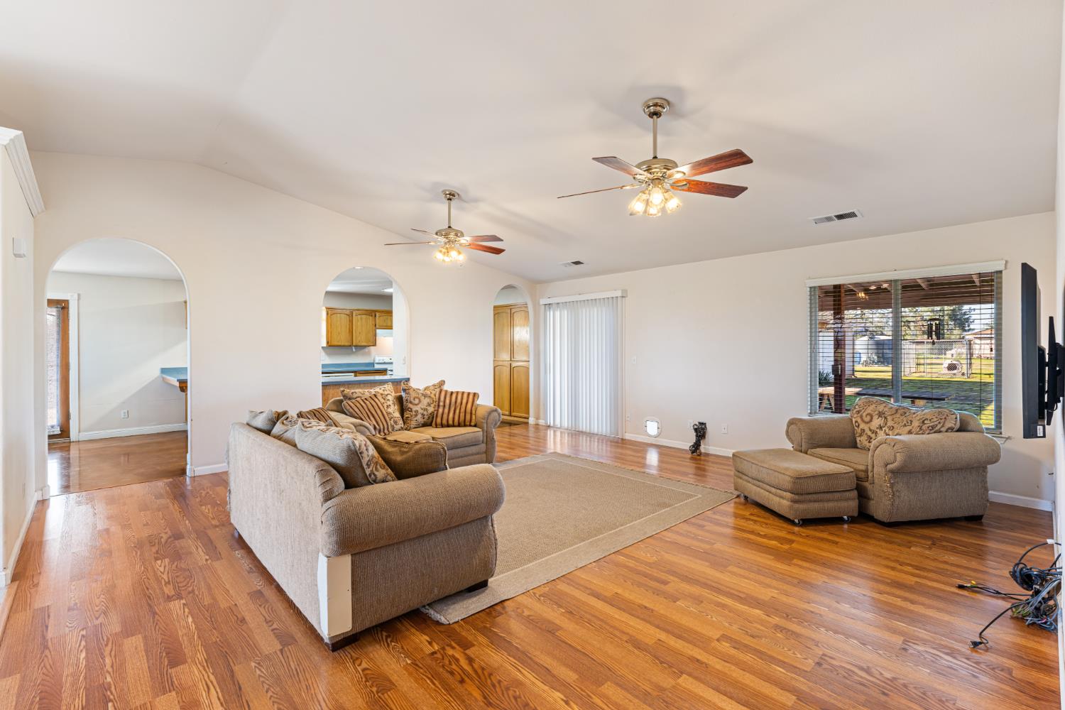 14304 Huntington Road Madera, CA 93636 - Photo 8 of 33 a living room with furniture and wooden floor