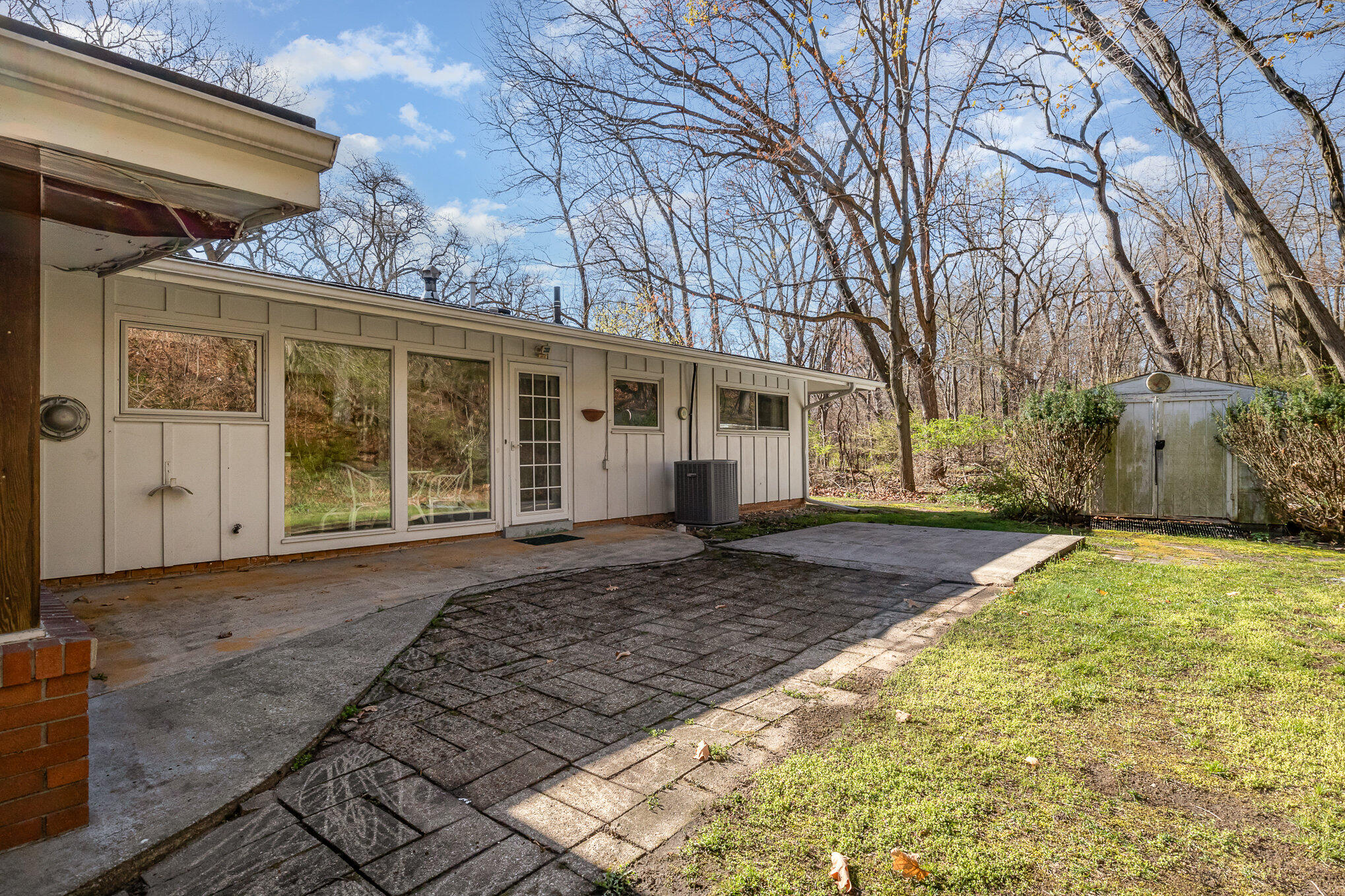 2147 Chastleton Drive Long Beach, IN 46360 - Photo 15 of 16 a house with trees in front of it