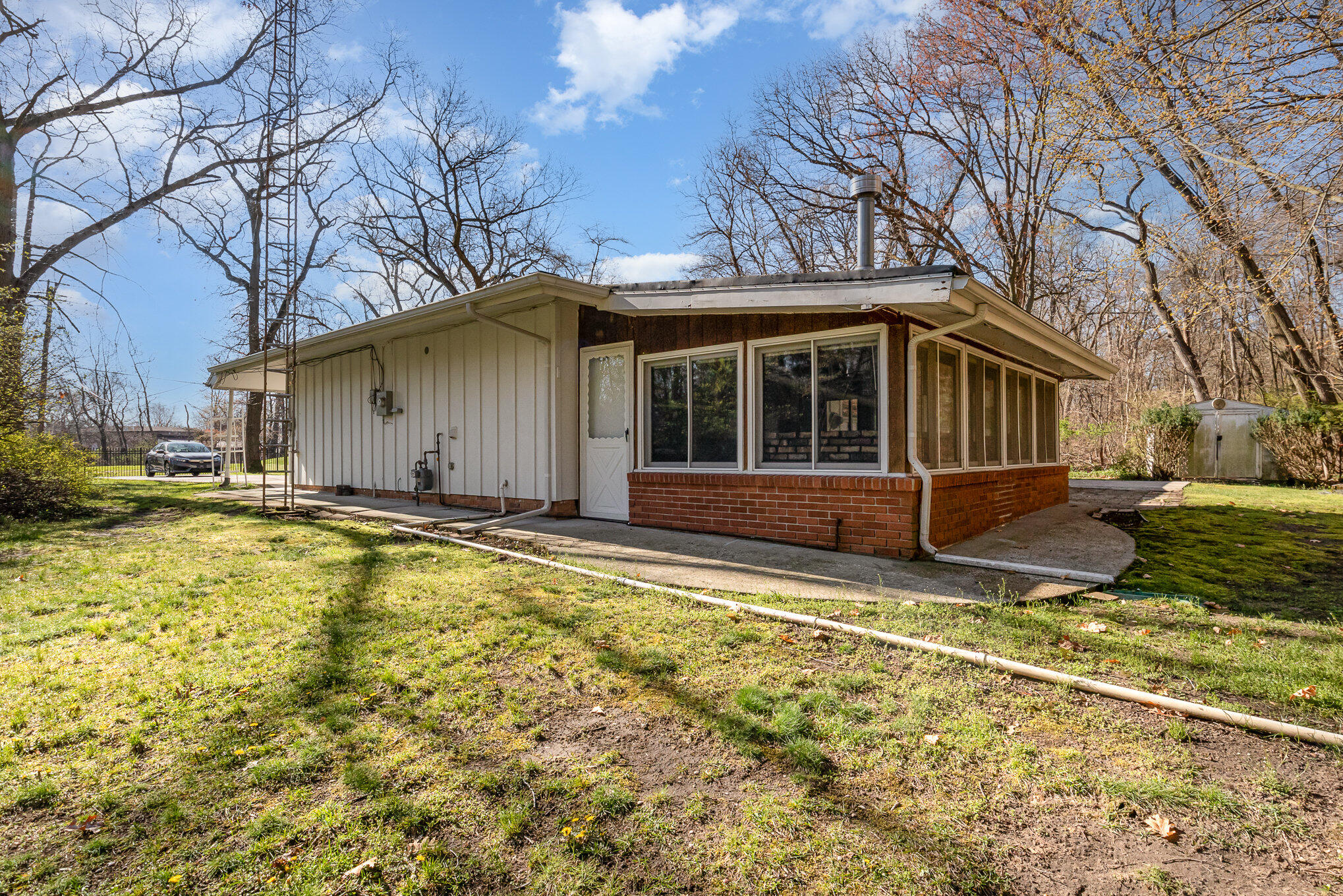 2147 Chastleton Drive Long Beach, IN 46360 - Photo 16 of 16 a view of a house with a yard patio and a yard