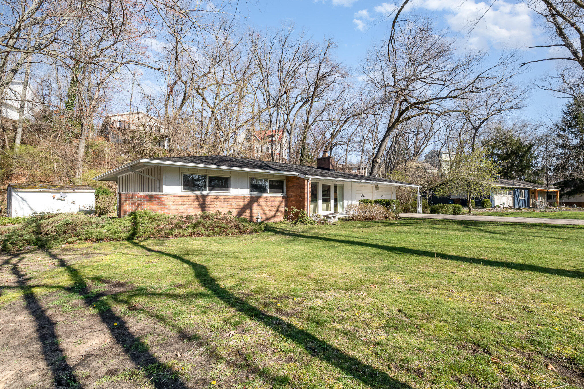2147 Chastleton Drive Long Beach, IN 46360 - Photo 3 of 16 a front view of a house with a yard table and chairs