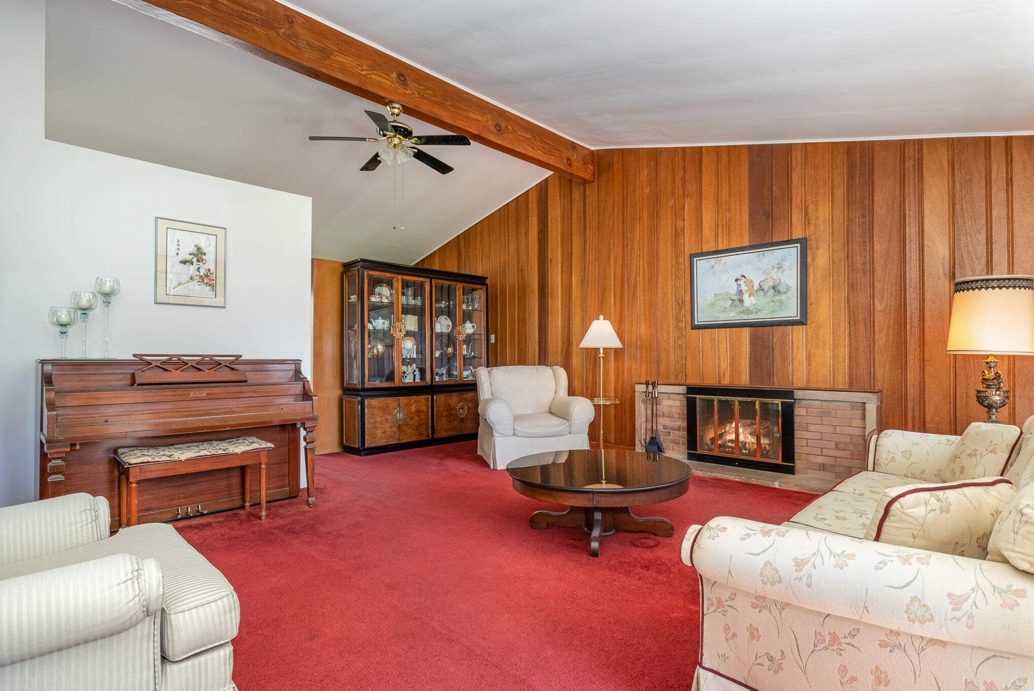 2147 Chastleton Drive Long Beach, IN 46360 - Photo 7 of 16 a living room with furniture a fireplace and a large window