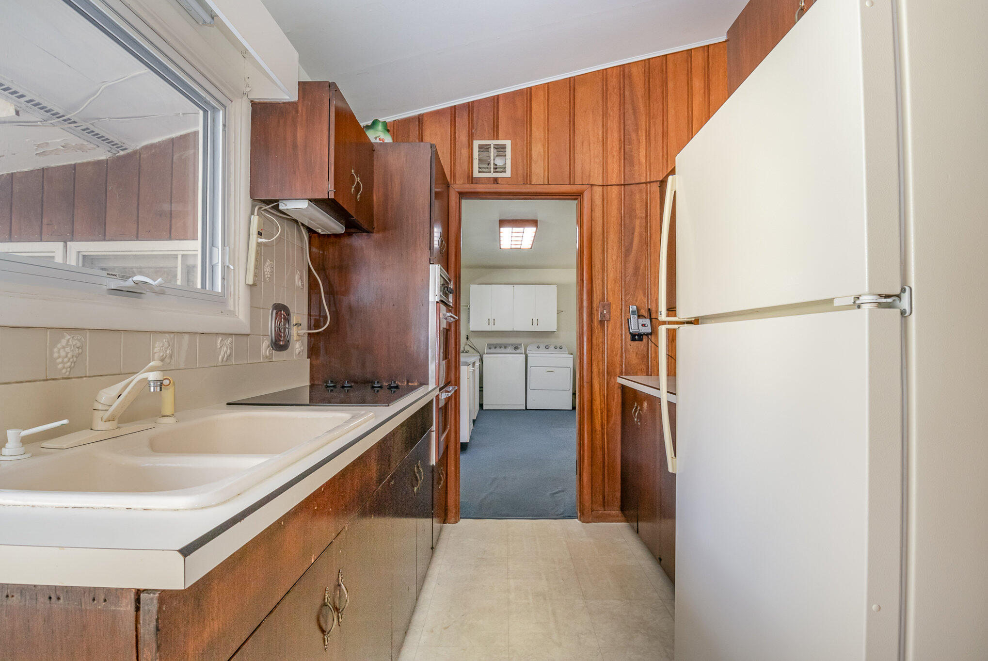 2147 Chastleton Drive Long Beach, IN 46360 - Photo 9 of 16 a kitchen with a refrigerator and a sink