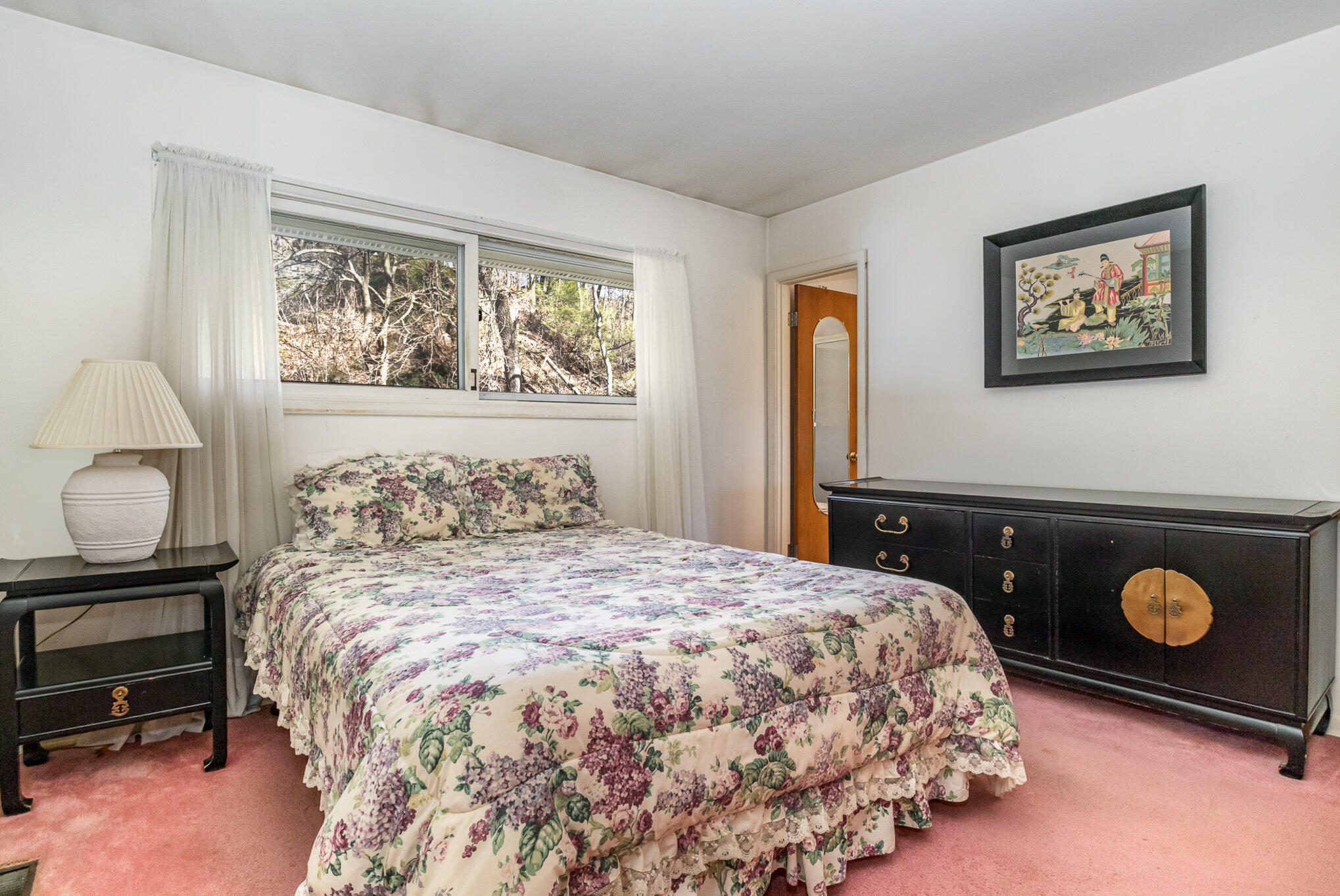 2147 Chastleton Drive Long Beach, IN 46360 - Photo 10 of 16 a bedroom with a bed and a window