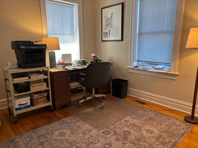 a room with gym equipment and a large window