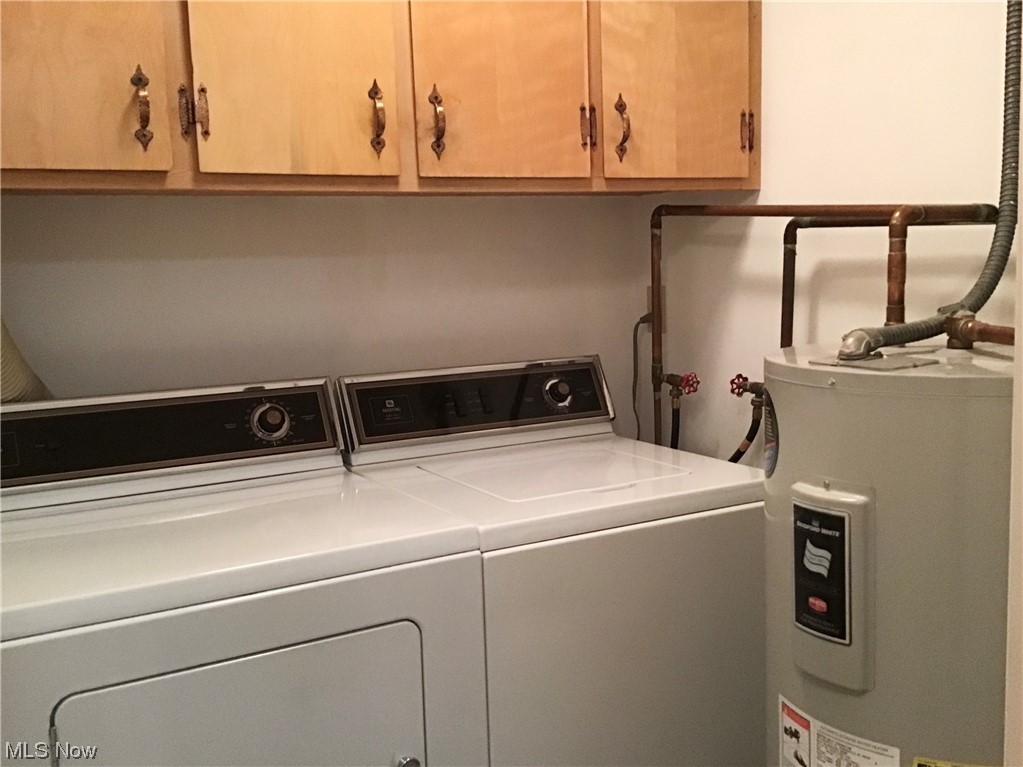 8947 West Ridge Road, Unit C Elyria, OH 44035 - Photo 10 of 27 In suite utility room. Note cabinets. Washer and dryer to stay.