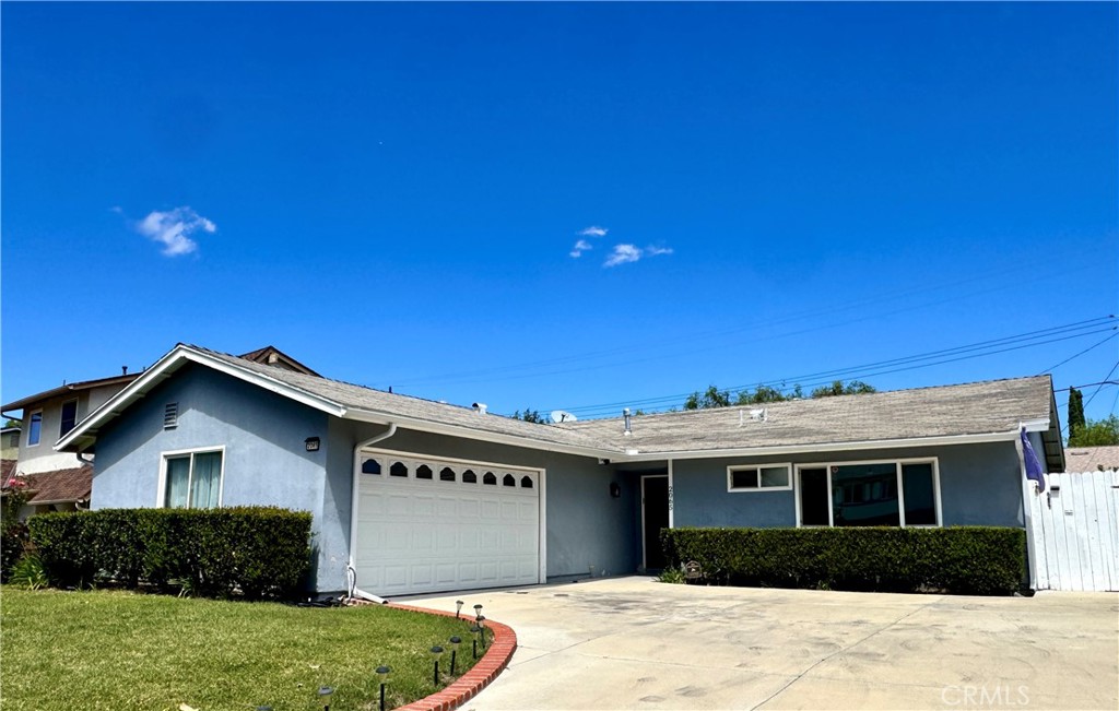 2065 Morley Street Simi Valley, CA 93065 - Photo 1 of 13 a front view of a house with a yard