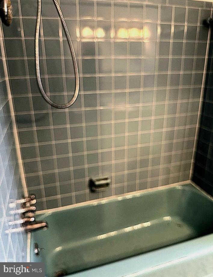 6426 Noble Drive McLean, VA 22101 - Photo 9 of 16 a bathroom with a bath tub