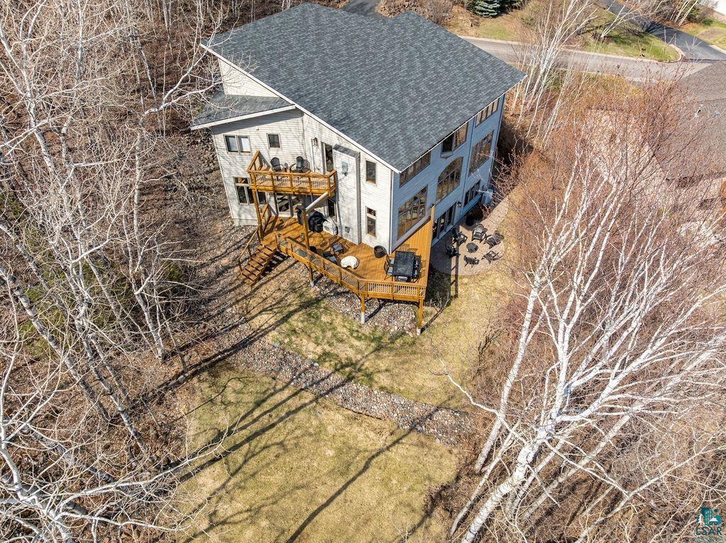 4856 Kingston Street Duluth, MN 55804 - Photo 66 of 88 Multi-level residential structure featuring light-colored siding and a dark shingle roof