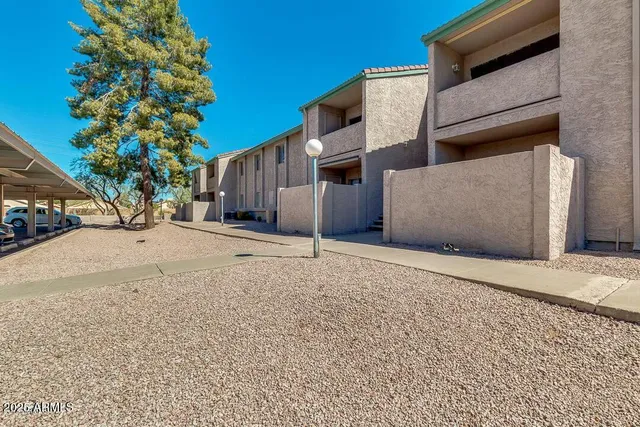 a kitchen with stainless steel appliances granite countertop a sink and a refrigerator