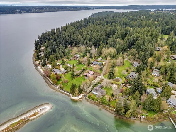 a view of a lake with a house and a yard