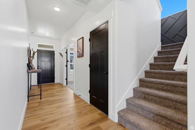 3902 West 825 North West Point, UT 84015 - Photo 28 of 49 Foyer featuring stairs and light wood finished floors