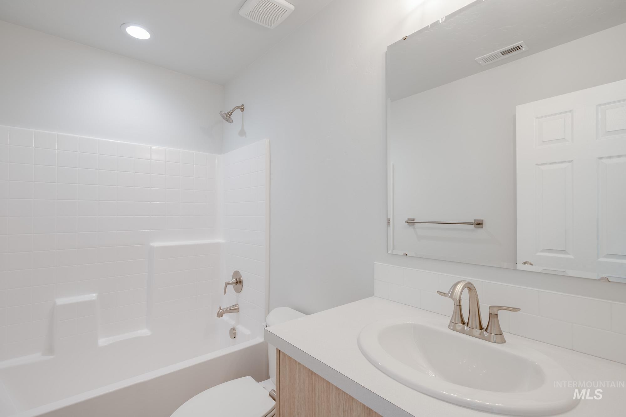 1614 Long Pond Street Middleton, ID 83644 - Photo 25 of 28 Full bathroom featuring bathing tub / shower combination and vanity