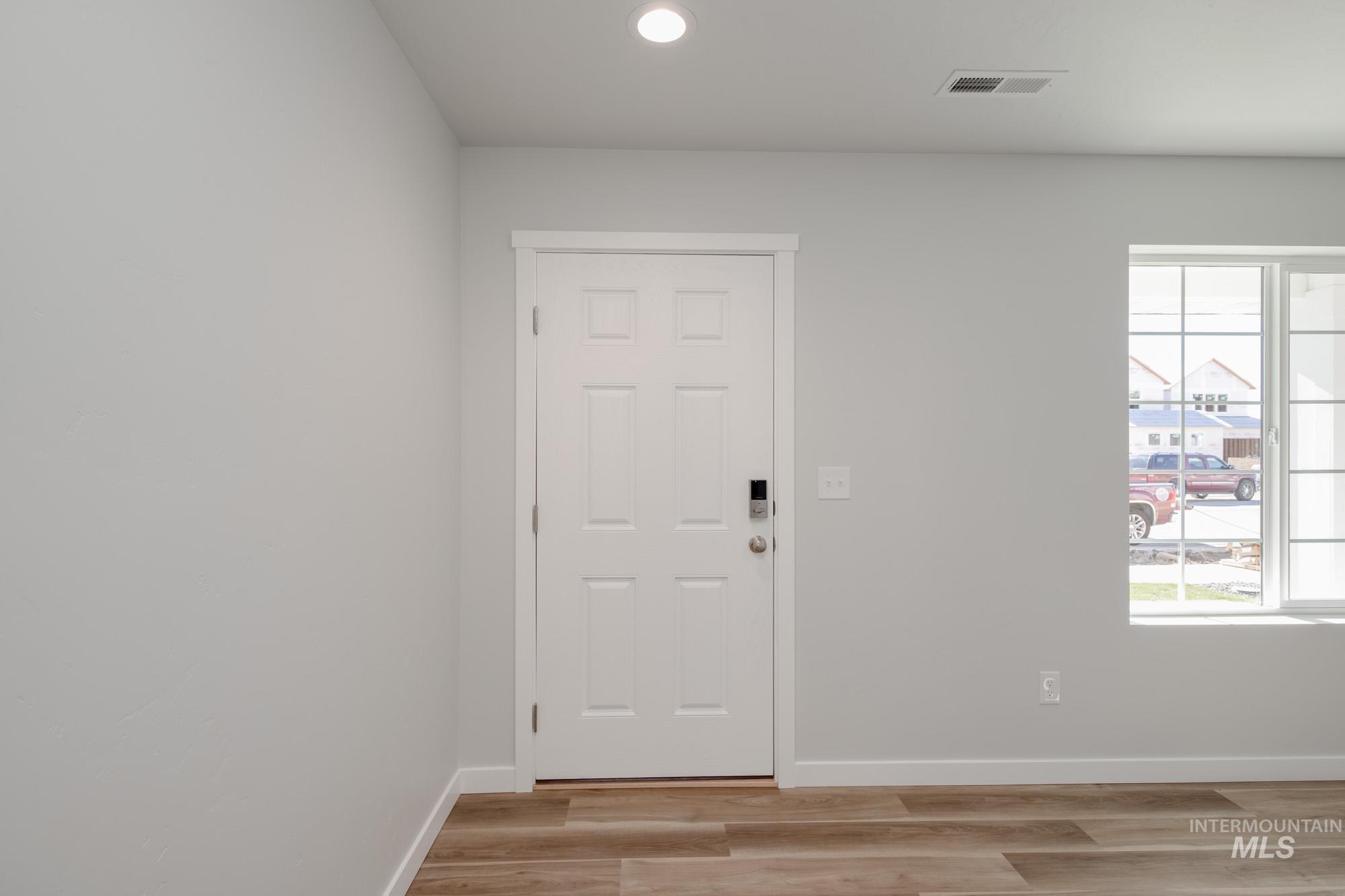 1614 Long Pond Street Middleton, ID 83644 - Photo 3 of 28 Foyer entrance with recessed lighting and light wood-style flooring