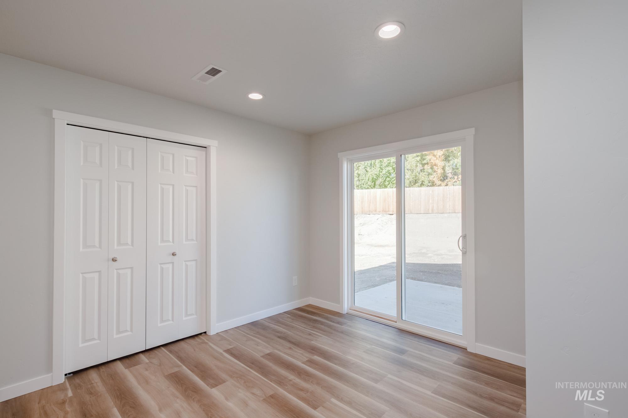 1614 Long Pond Street Middleton, ID 83644 - Photo 6 of 28 Unfurnished bedroom with access to exterior, light wood finished floors, recessed lighting, and a closet