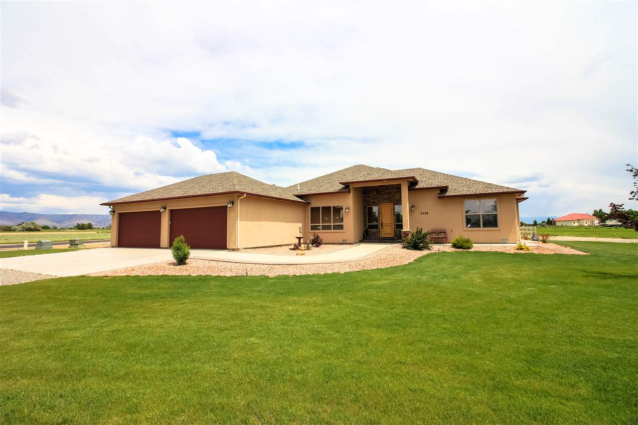 a front view of house with yard and seating area