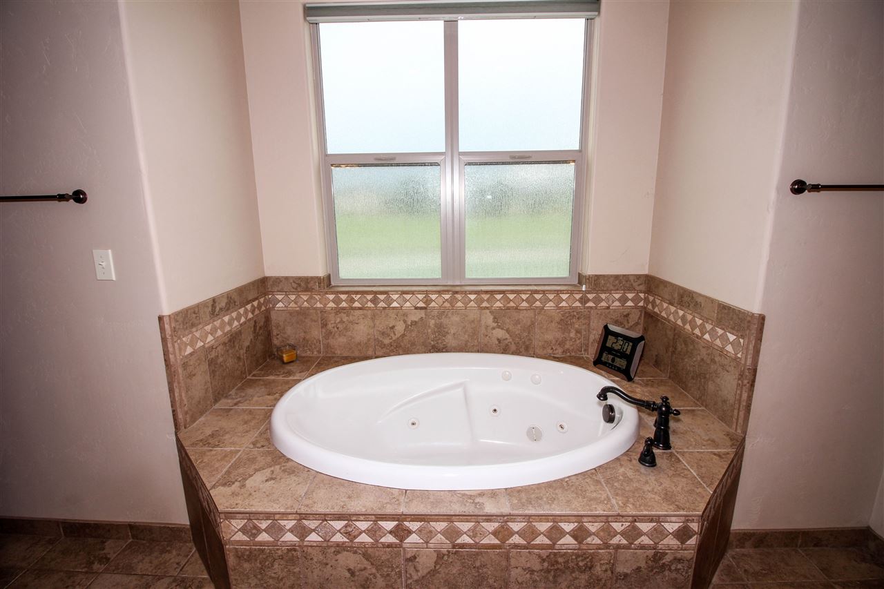 1114 22 Road Grand Junction, CO 81505 - Photo 15 of 26 a bathroom with a sink and a window