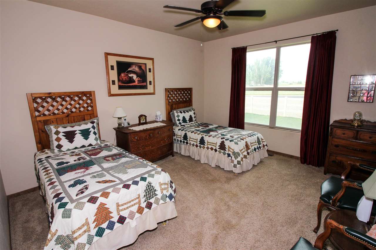 1114 22 Road Grand Junction, CO 81505 - Photo 17 of 26 a bedroom with two beds and a window