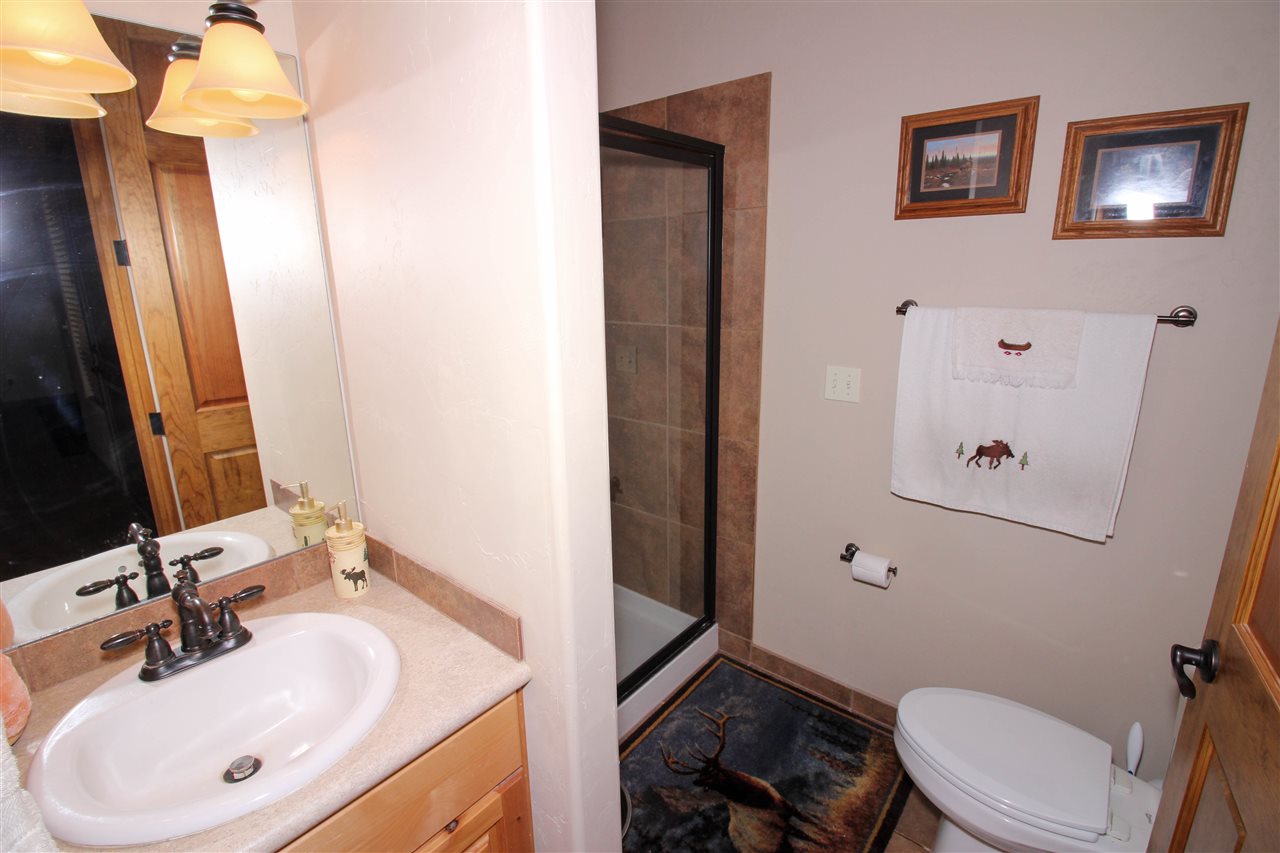 1114 22 Road Grand Junction, CO 81505 - Photo 18 of 26 a bathroom with a sink a toilet and shower
