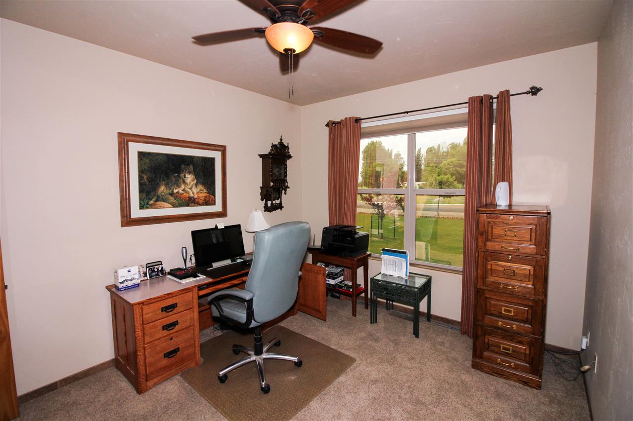 1114 22 Road Grand Junction, CO 81505 - Photo 19 of 26 a view of a workspace with furniture and a window