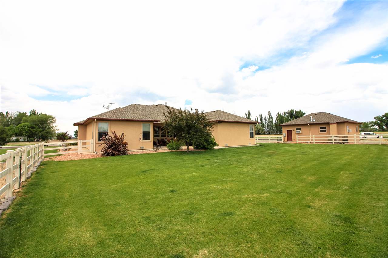 1114 22 Road Grand Junction, CO 81505 - Photo 21 of 26 a front view of a house with garden