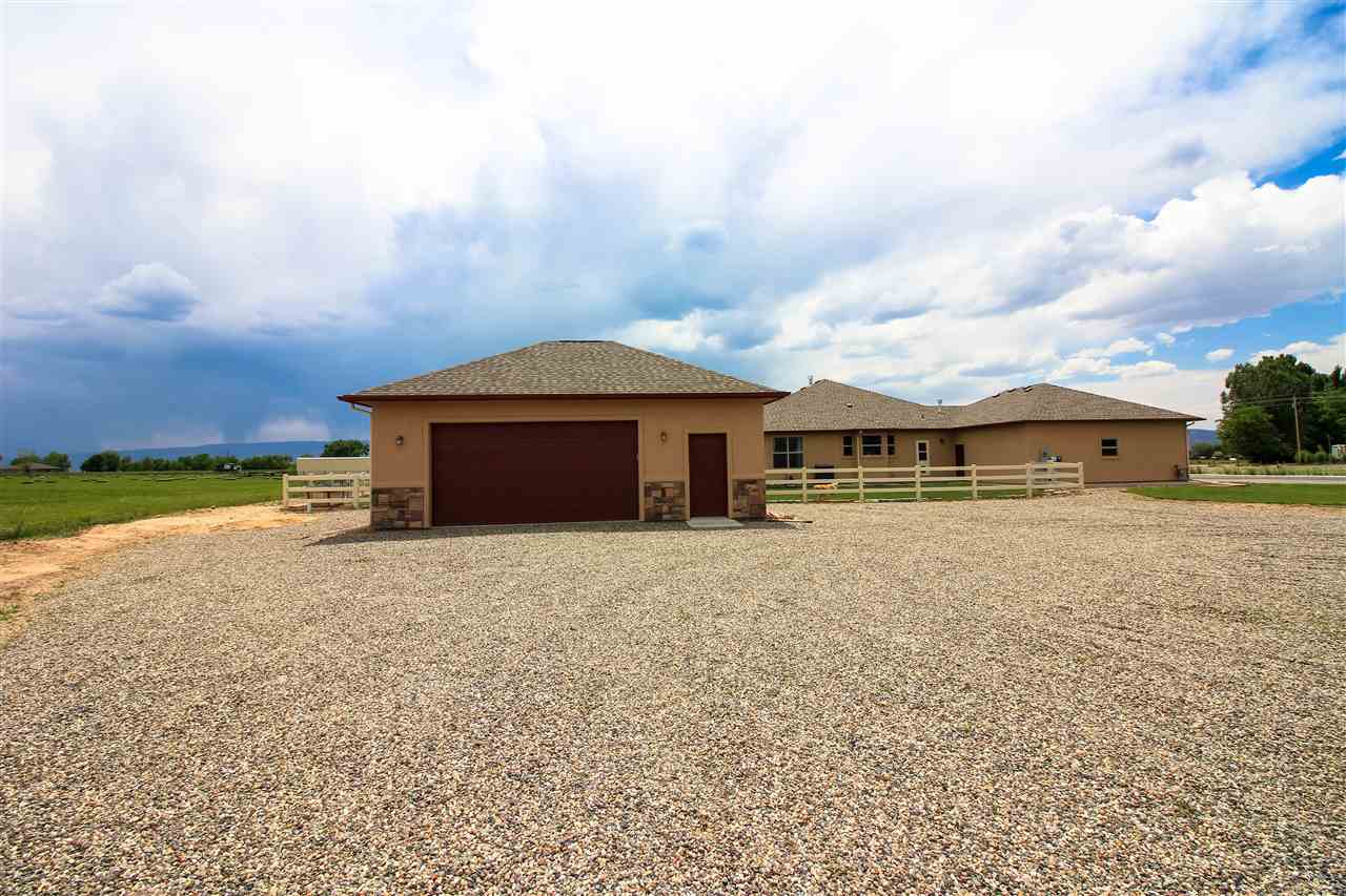 1114 22 Road Grand Junction, CO 81505 - Photo 24 of 26 front view of a house with a yard