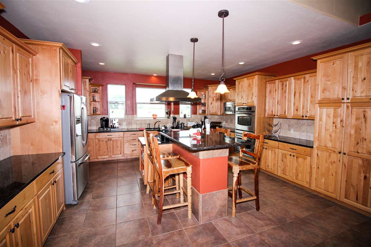 1114 22 Road Grand Junction, CO 81505 - Photo 6 of 26 a view of a kitchen with kitchen island granite countertop lots of counter top space