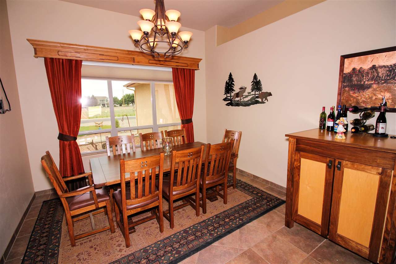 1114 22 Road Grand Junction, CO 81505 - Photo 9 of 26 a view of a dining room with furniture window and outside view